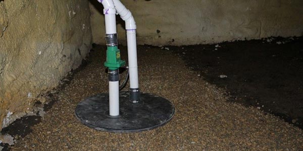 A sump pump installed in a crawl space foundation