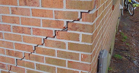 A stairstep crack in a brick foundation