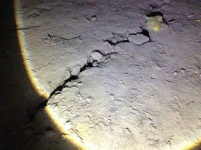 A foundation where there is a large crack on the floor surface