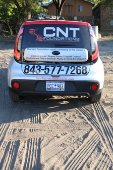 a car with a CNT logo wrap